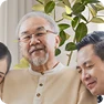 Customer Testimonial Photo Smiling customer Stan Barth with family sharing his review of a PVE home elevator