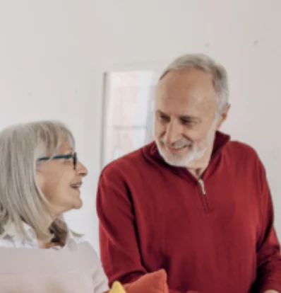 Happy senior couple customer testimonial Smiling senior couple, happy customers sharing their positive experience with a PVE home elevator